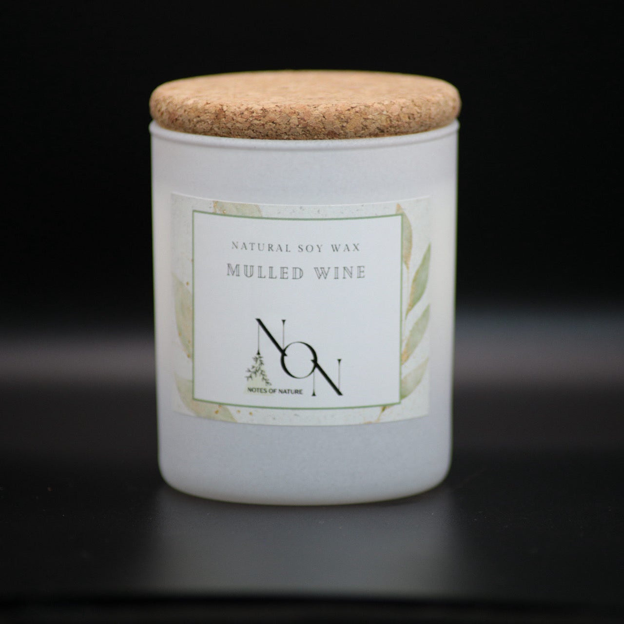 Candle jar with a cork lid on a black background, soy wax, handmande
