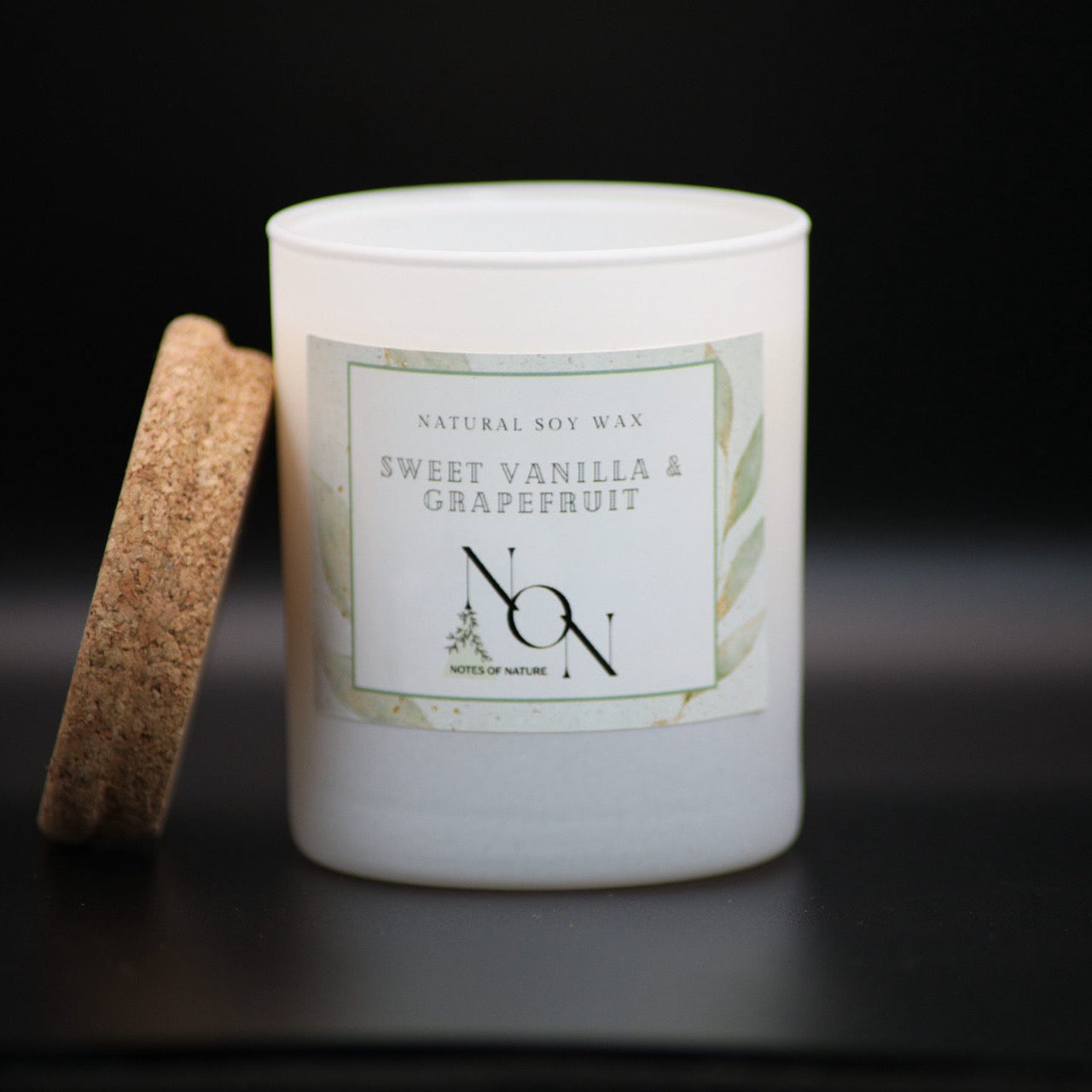 Candle jar with a cork lid on a black background, soy wax, handmande